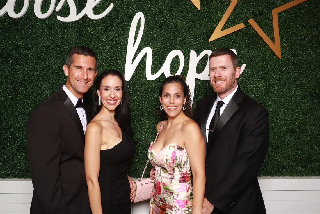 Wedding guests using a Strata Booth photo booth at an Orlando reception