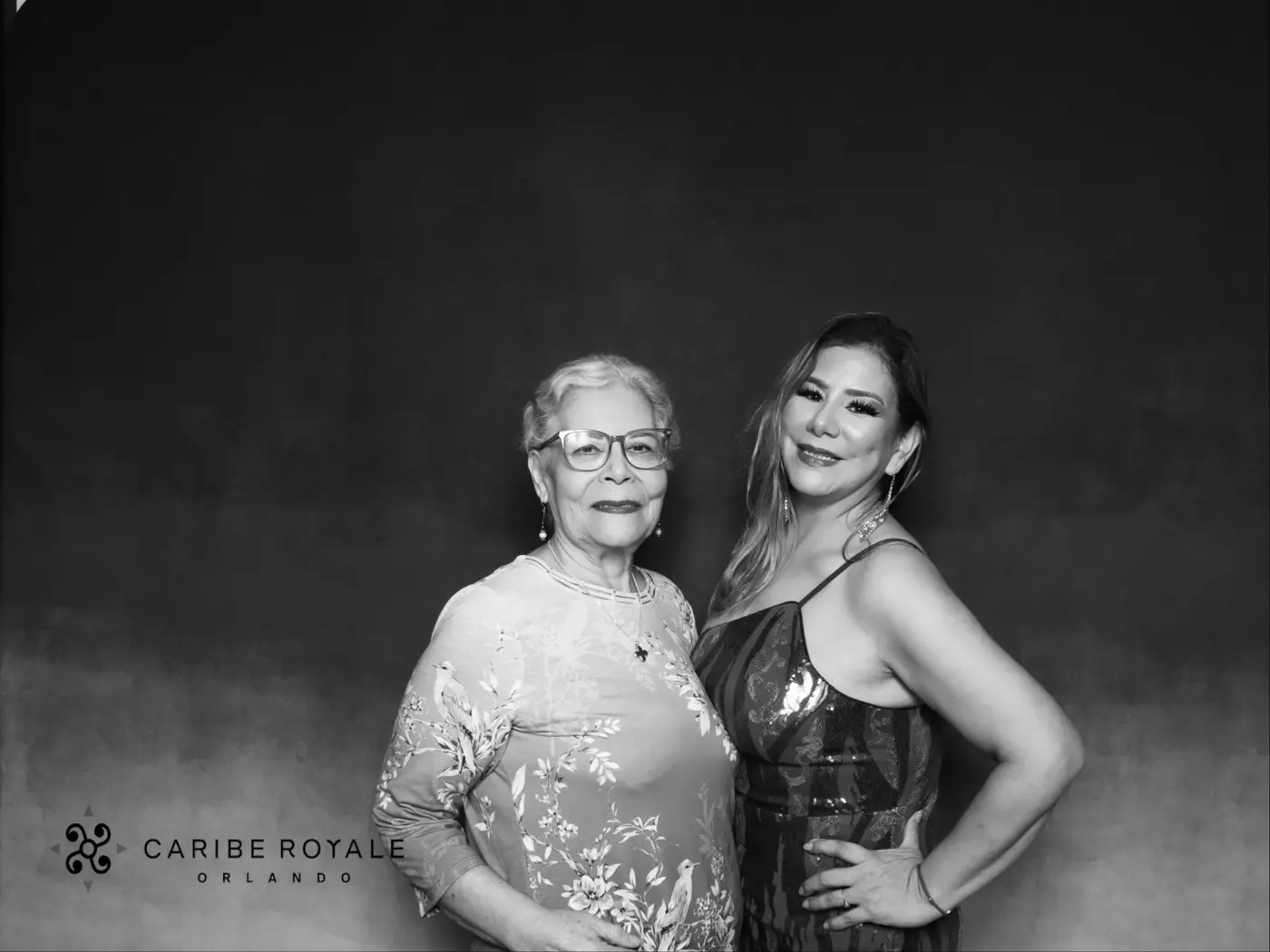 Coworkers posing together at the Caribe Royale holiday party photo booth