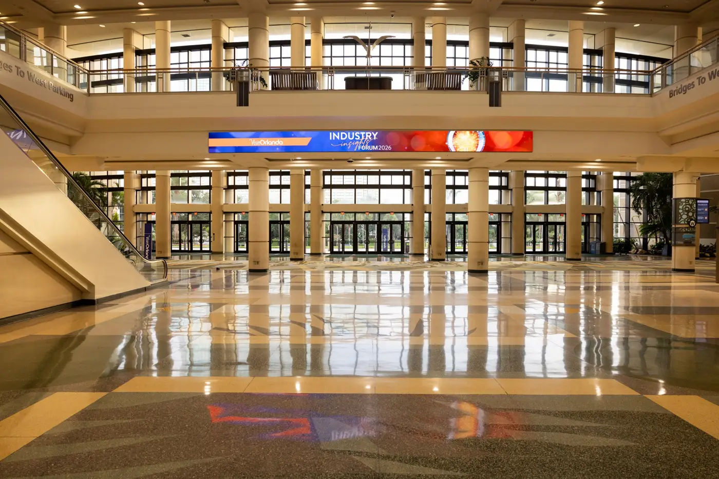 Industry Insights Forum signage spans the entrance doors inside the Orange County Convention Center.