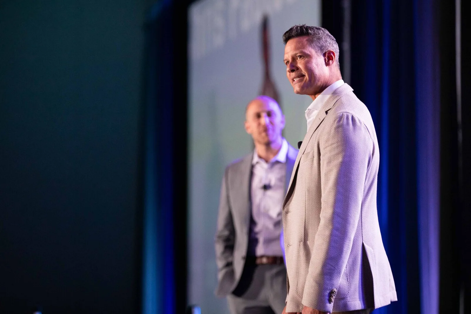Corporate event photography of a speaker on stage during a brand activation at a conference in Orlando