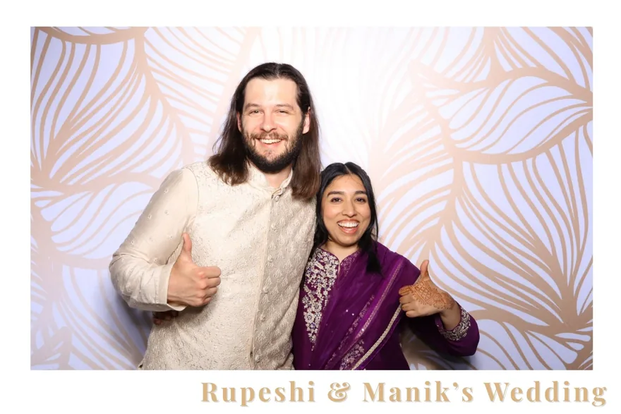 Couple in a custom-branded wedding photo booth template at an Orlando wedding