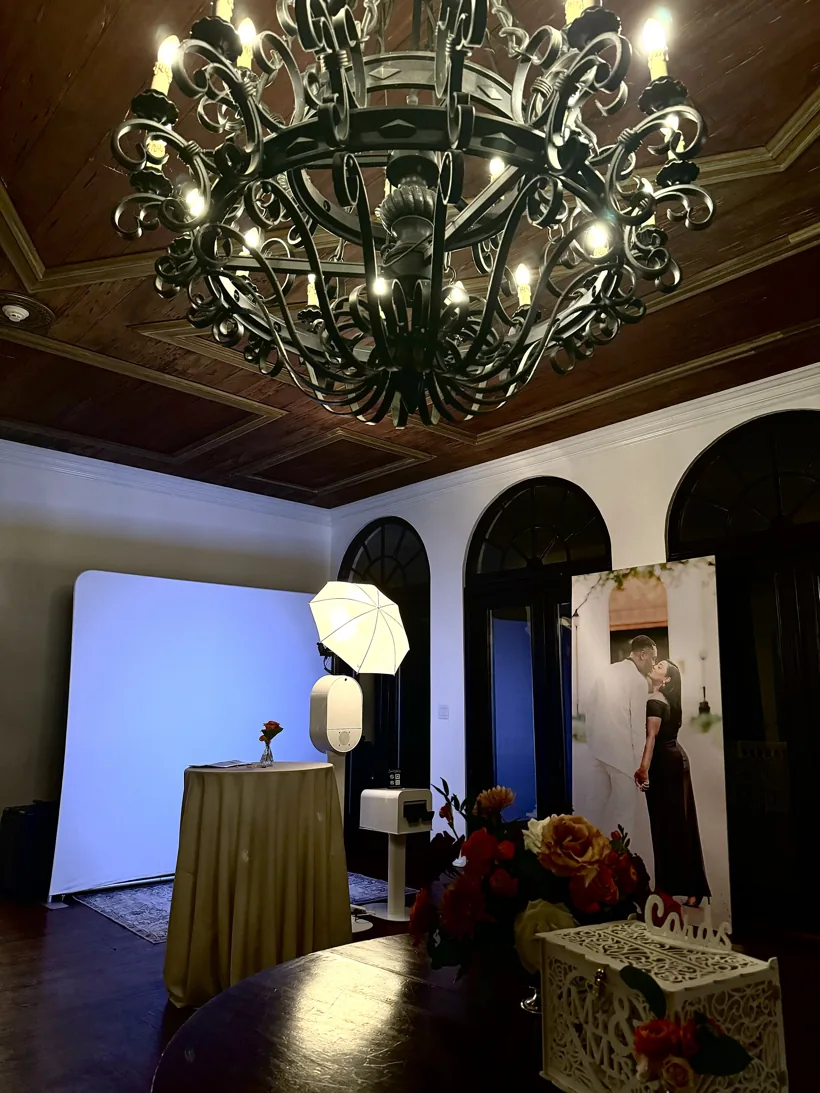 Wedding photo booth set up in an elegant Orlando venue with a chandelier