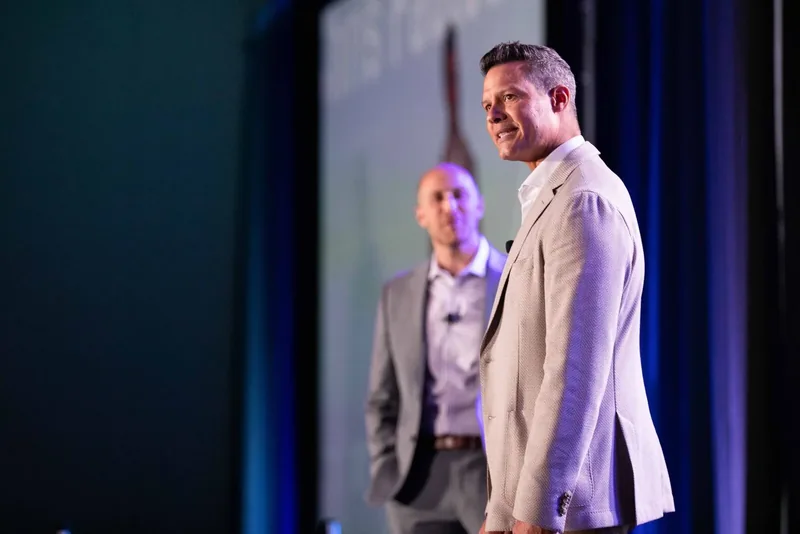 Corporate event photography of a speaker on stage during a brand activation at a conference in Orlando