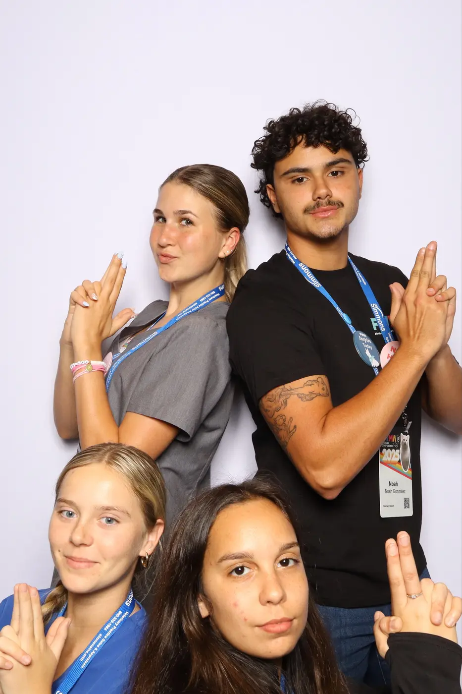 Group of FVMA attendees making playful poses for their mosaic photo