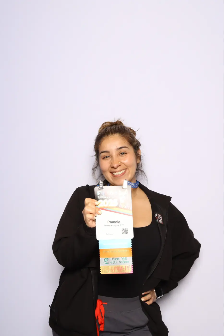 FVMA guest displaying her printed conference photograph
