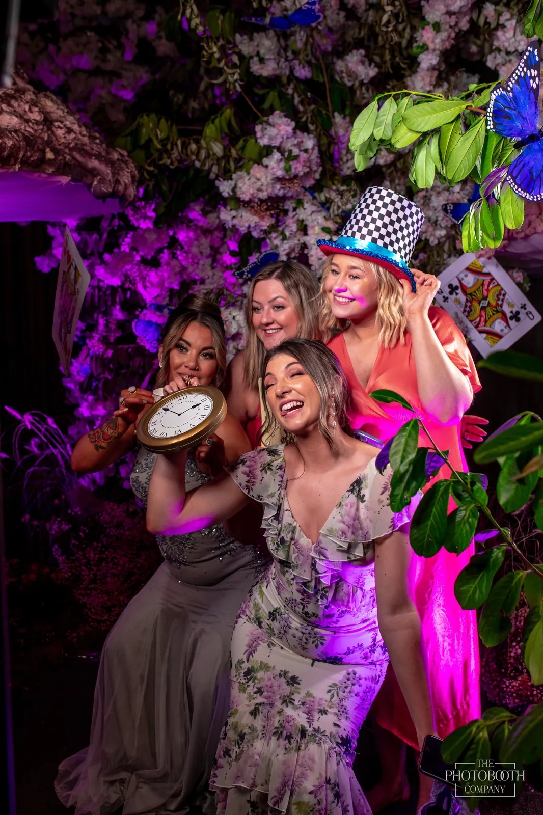 Guests posing with drinks at a glam branded photo activation at a corporate brand event