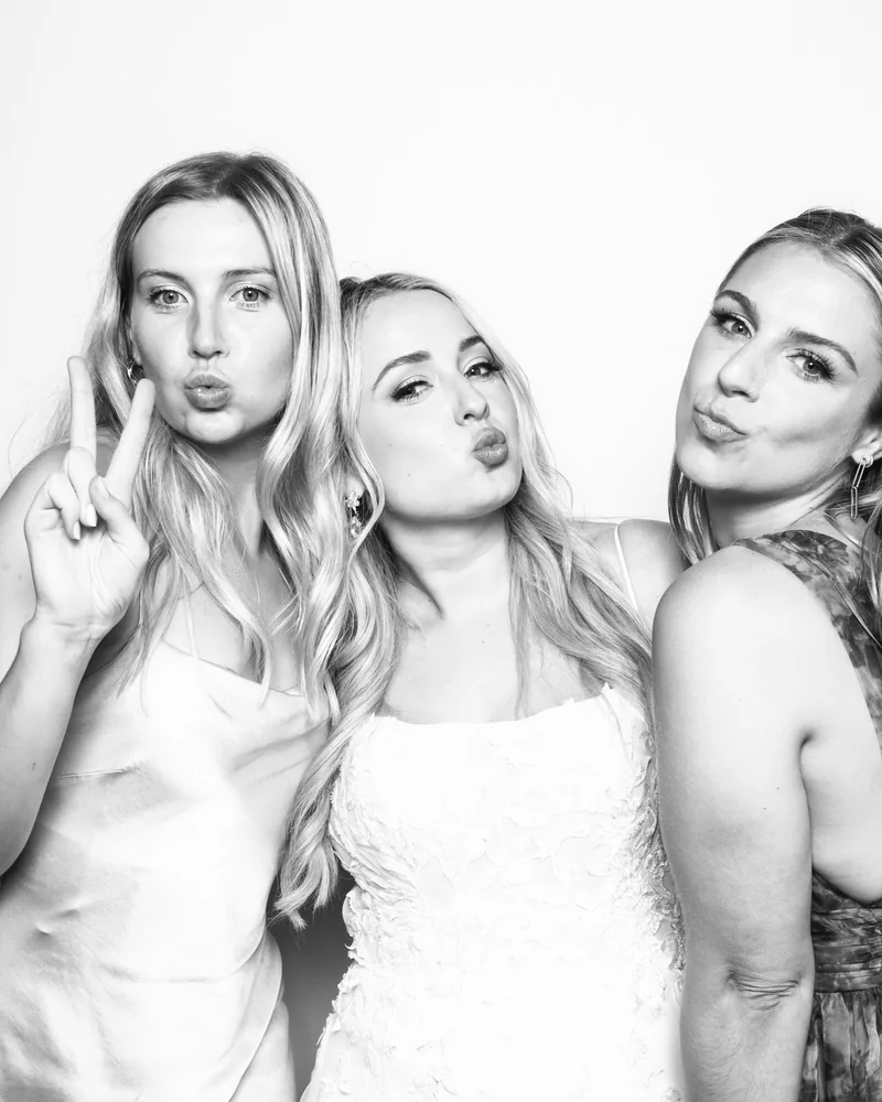 Guests using a glam photo booth at an Orlando gala
