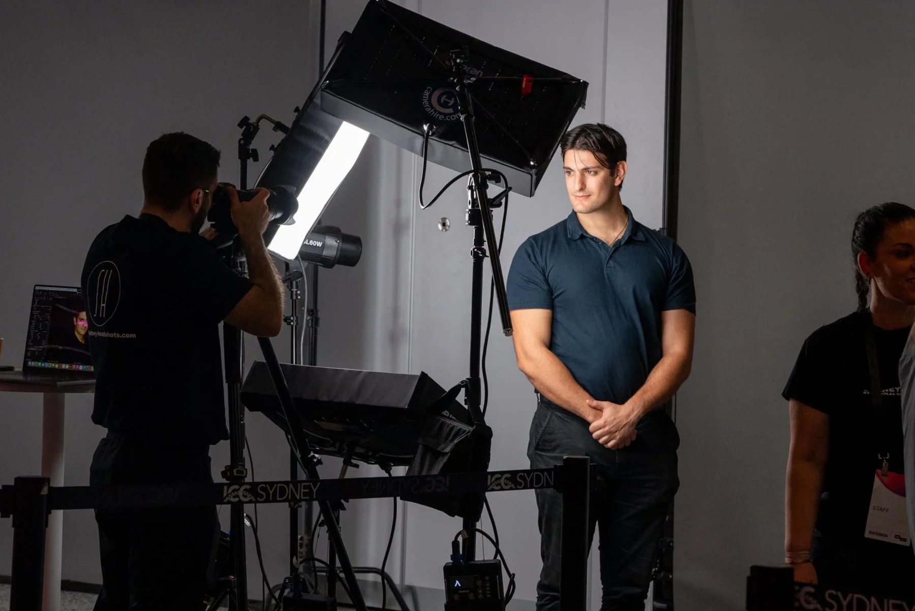 Photographer capturing a headshot with professional studio lighting