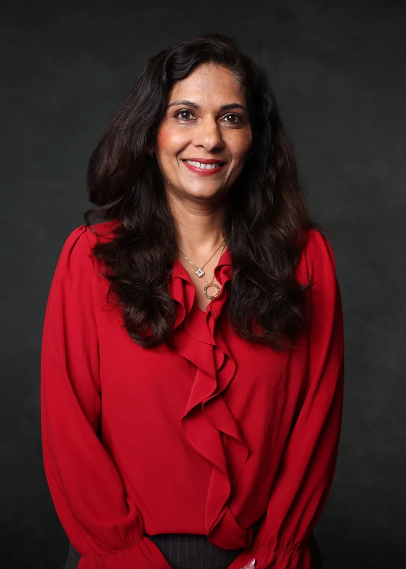 Dramatic dark-background executive headshot