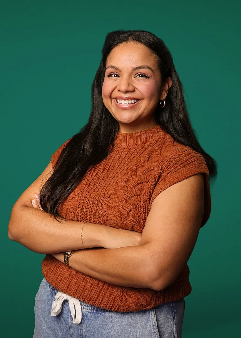 Modern professional headshot on an emerald green backdrop
