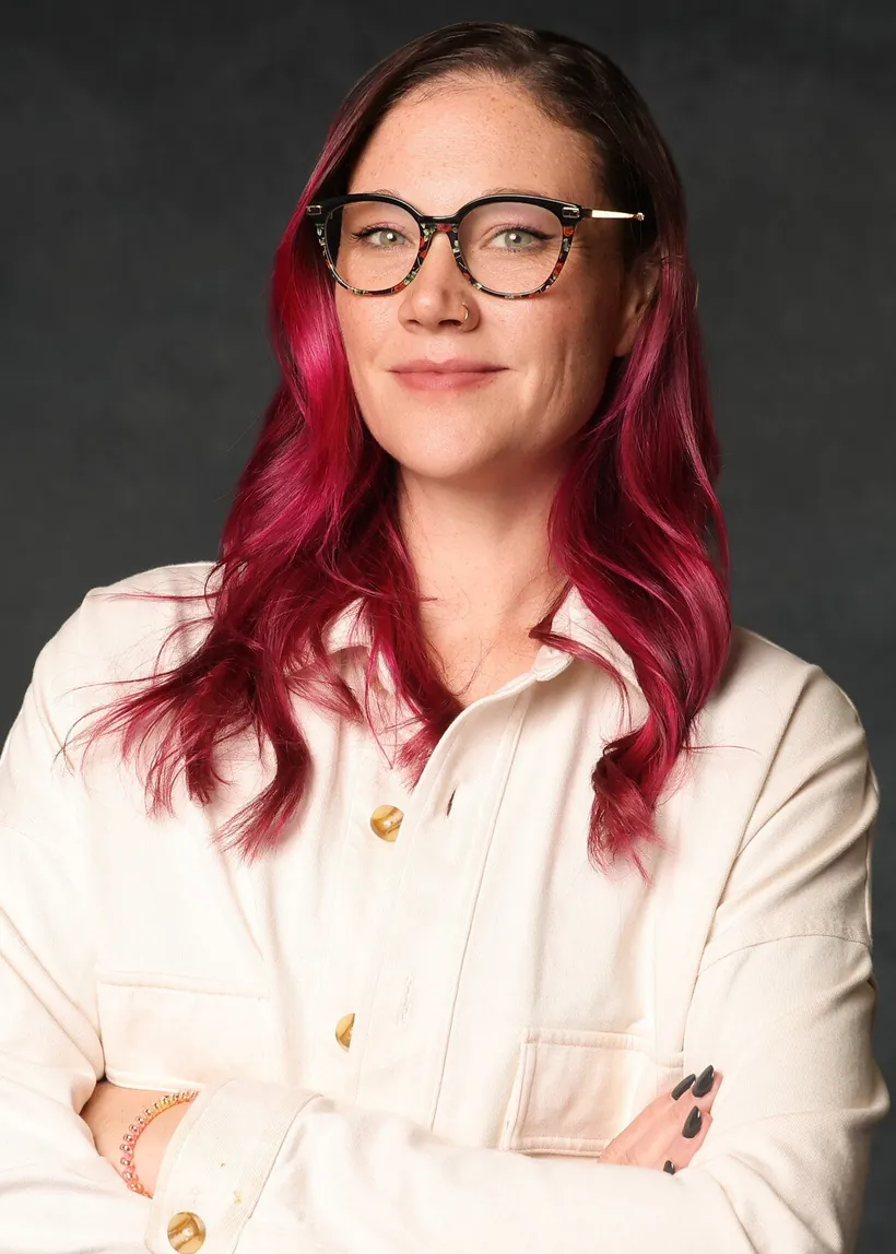 Professional headshot of an attendee wearing glasses