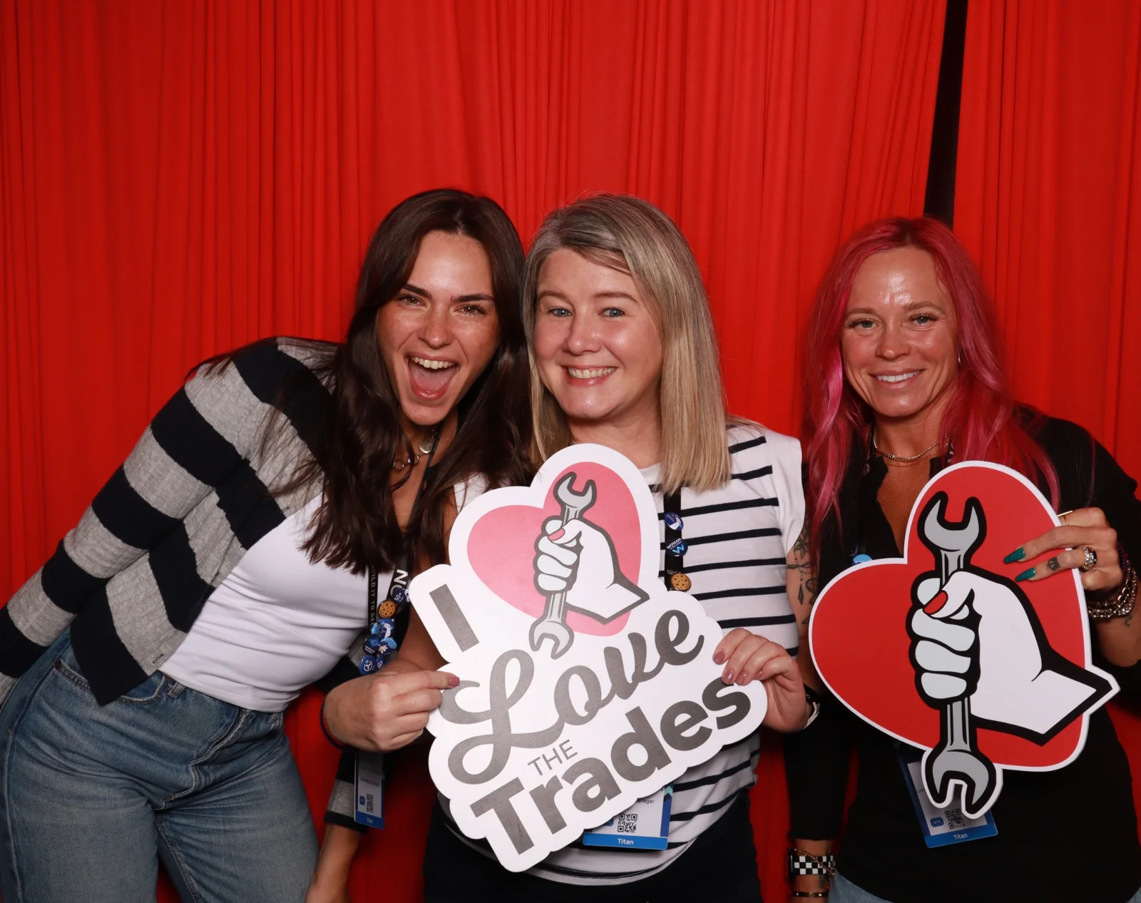 Three Sweet Shoppe Social guests smiling with Love the Trades and trade-themed props
