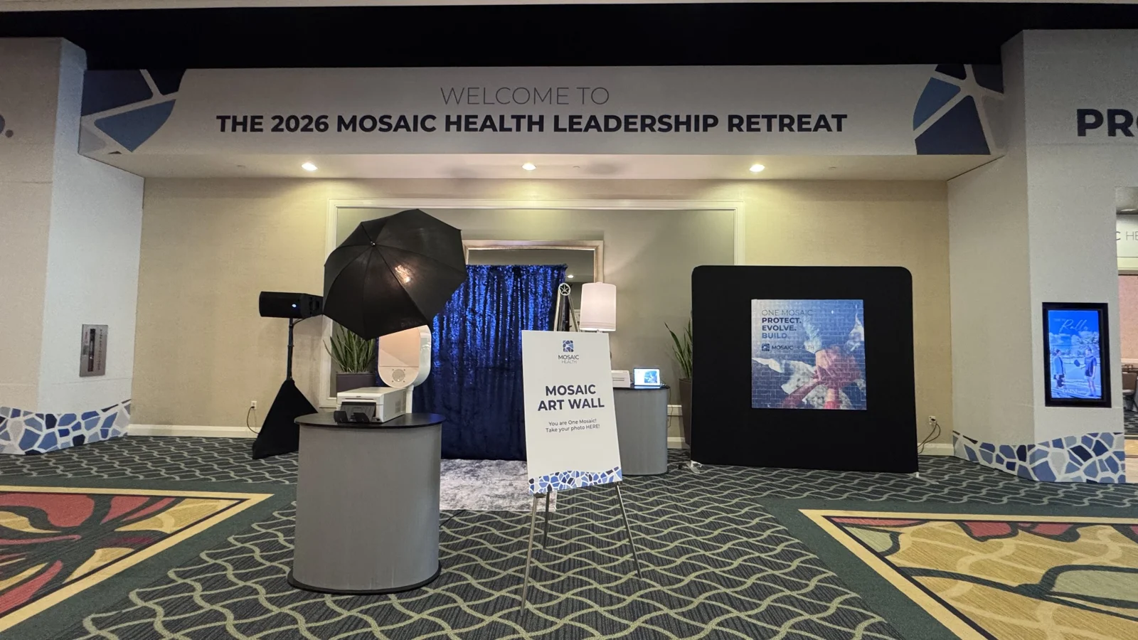 Photo booth and physical mosaic art wall at the 2026 Mosaic Health Leadership Retreat at Omni ChampionsGate