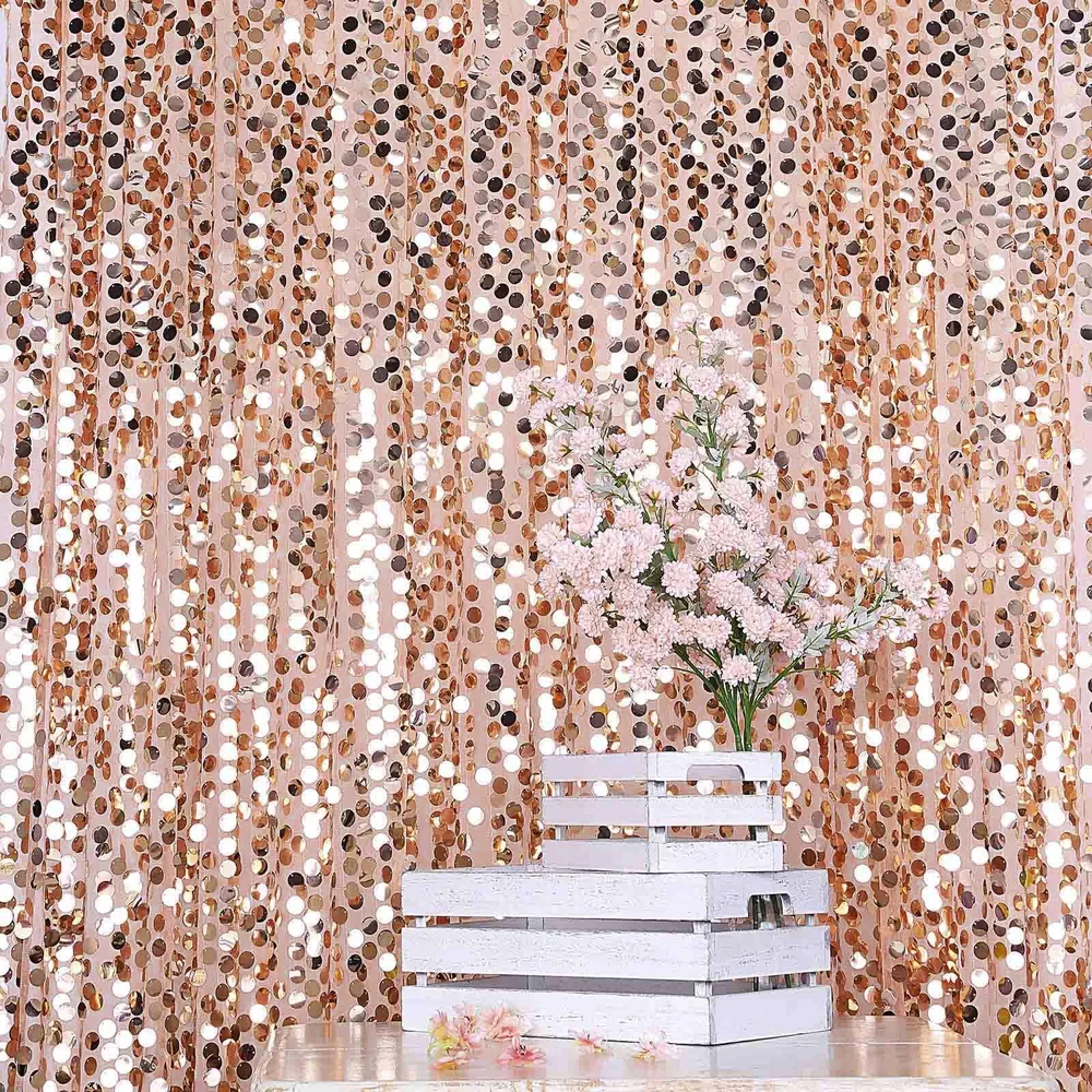 Rose gold sequin photo booth backdrop styled with florals for an Orlando wedding or event