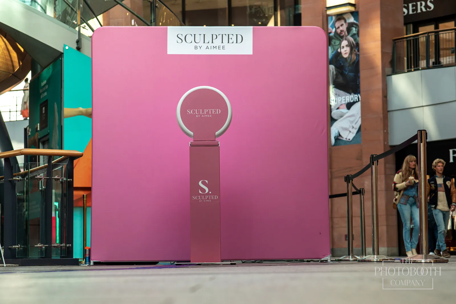 Branded experiential photo activation structure with custom sculpted signage at an outdoor brand event in Orlando
