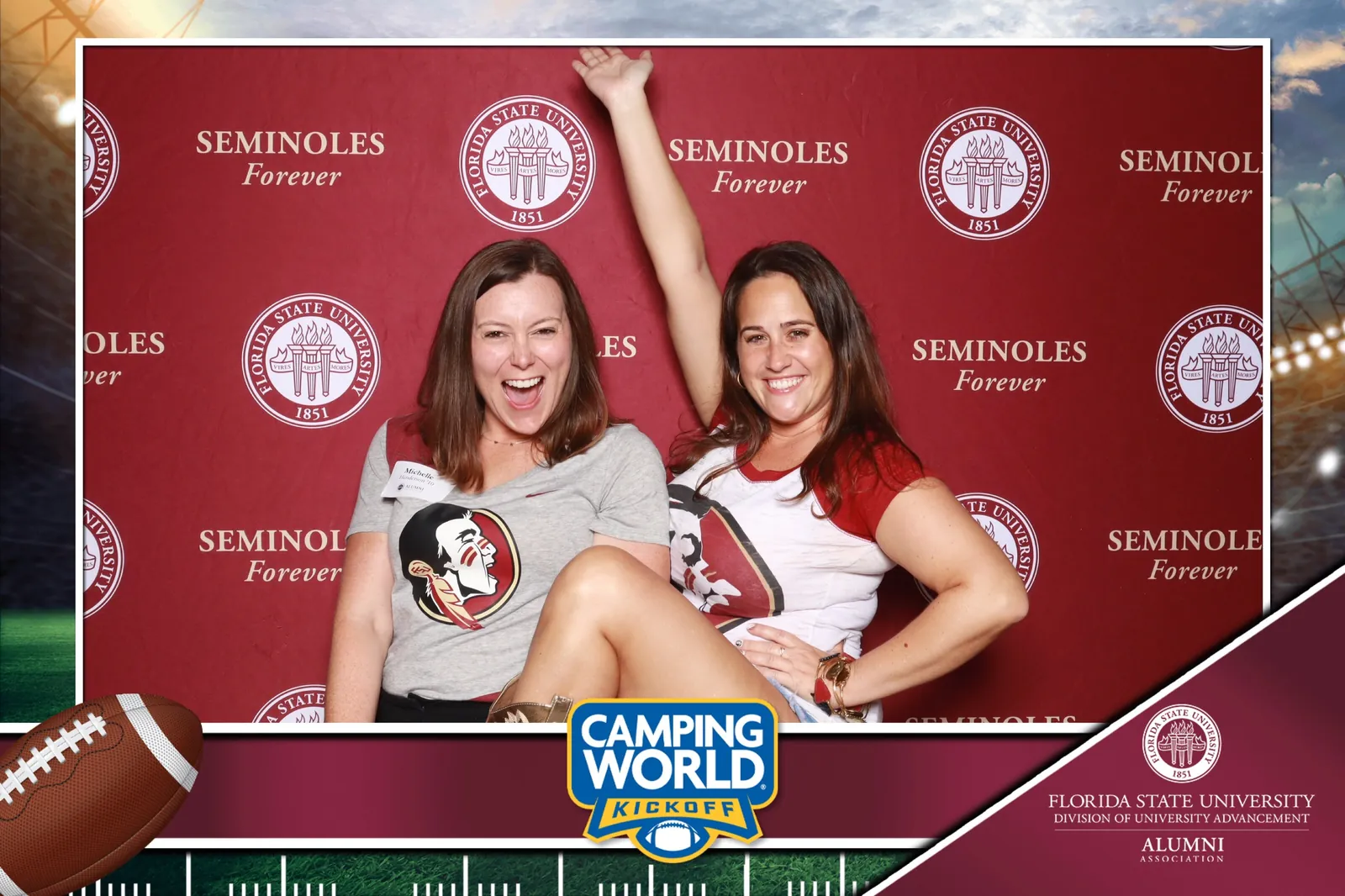 Guests at a branded sponsor step-and-repeat photo activation at a corporate event in Orlando