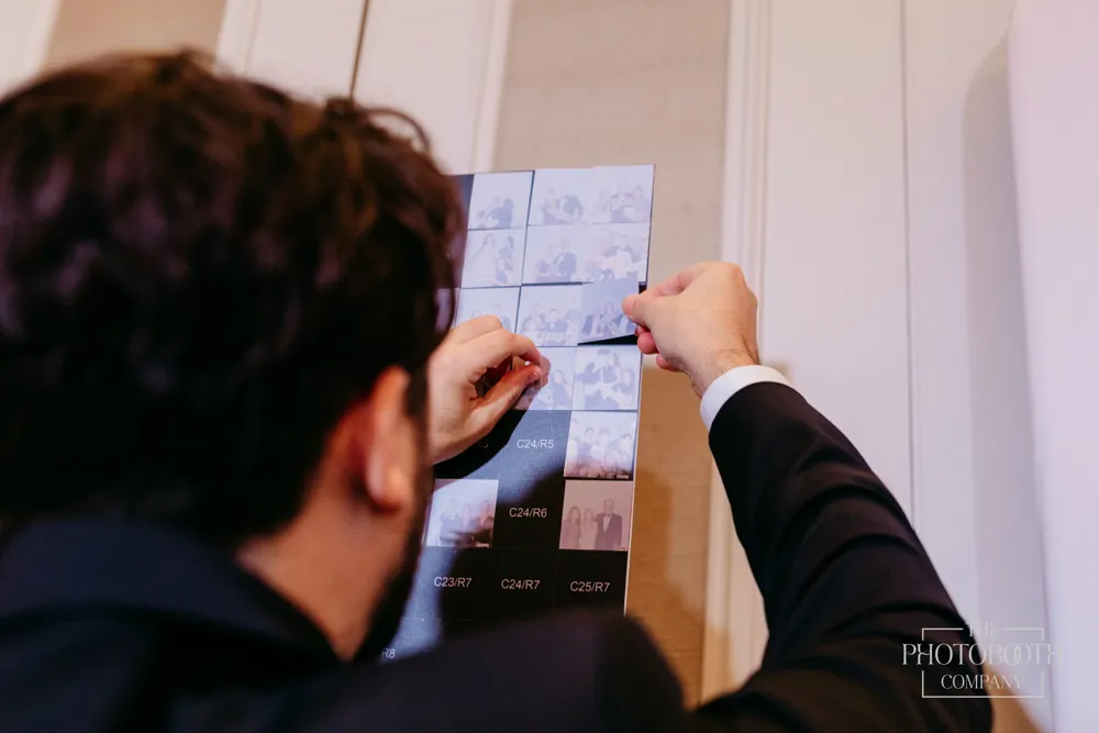 Guests contributing photos to a live Photo Mosaic Wall at an Orlando event